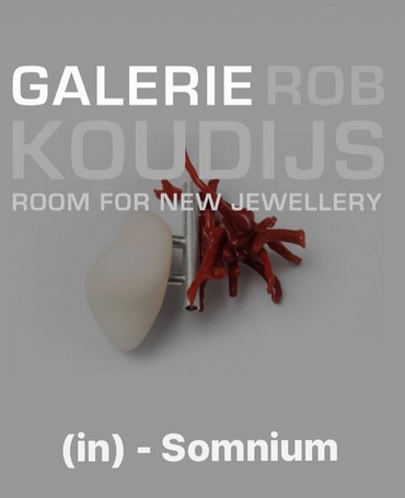 This image shows the poster for an exhibition at Galerie Rob Koudijs in Amsterdam where '(in) - Somnium': new work by Katja Prins is being shown. The poster image is one of Katja's brooches in 3D printed polymer combined with silver units and red coral.